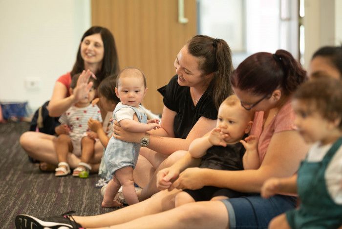 Babies and parents enjoying stories at the library.