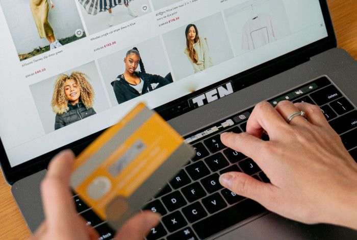 Someone making a suspicious online purchase with credit card.