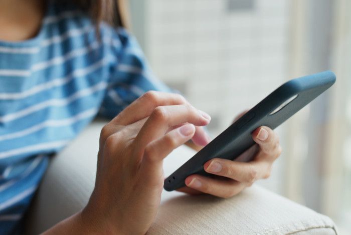 Closeup of person using a mobile phone.