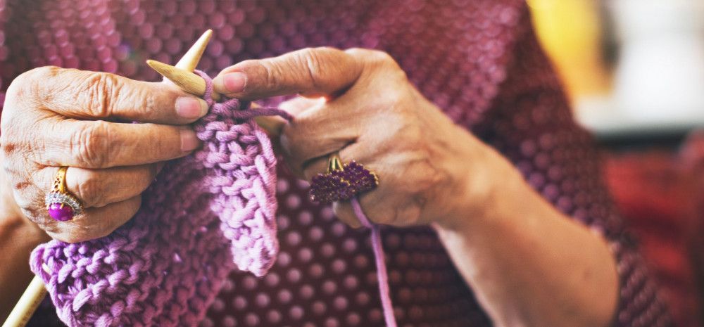 Image of a person knitting.