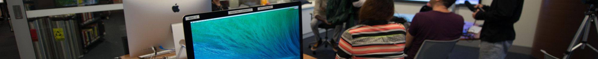 A group of people attending a class at the library.