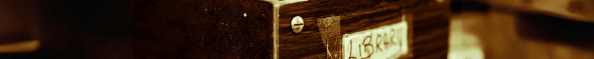 An old fashioned library card cataloguing system. The word Library appears.