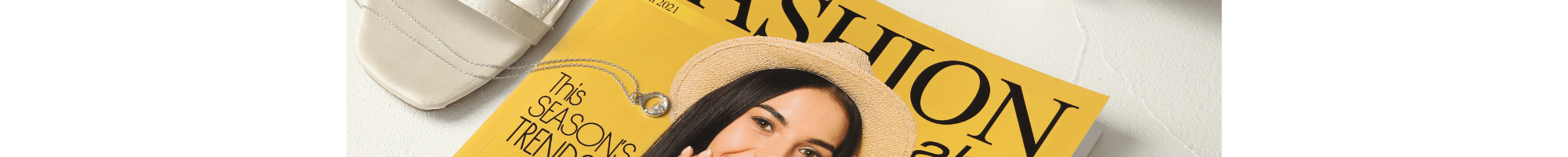 A yellow Fashion magazine with some high heel shoes.