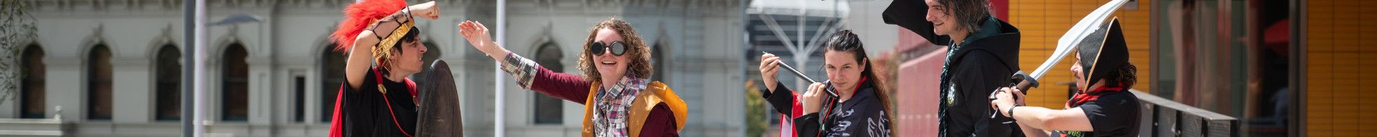 Library staff dressed in costumes such as superheroes and pirates.