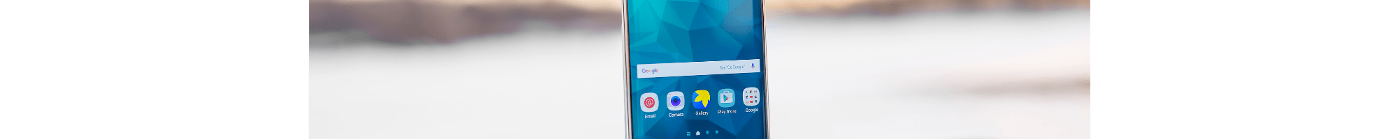 A phone on an outdoor table.