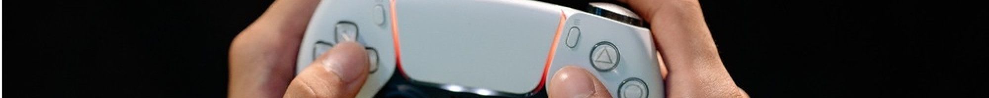 Games controller with hands on the controls.