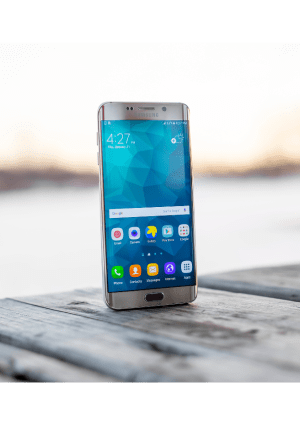 A phone on an outdoor table.